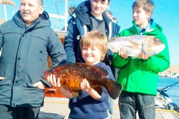 family holding fish